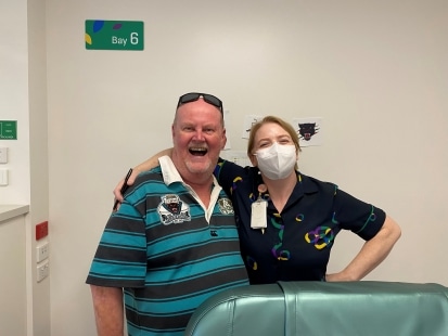 Bob standing with his Icon team member