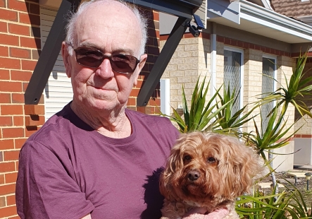Robert holding his little dog